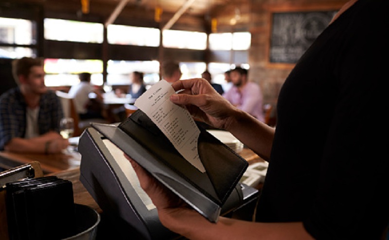 Preparing the bill at a restaurant to be taken to a table