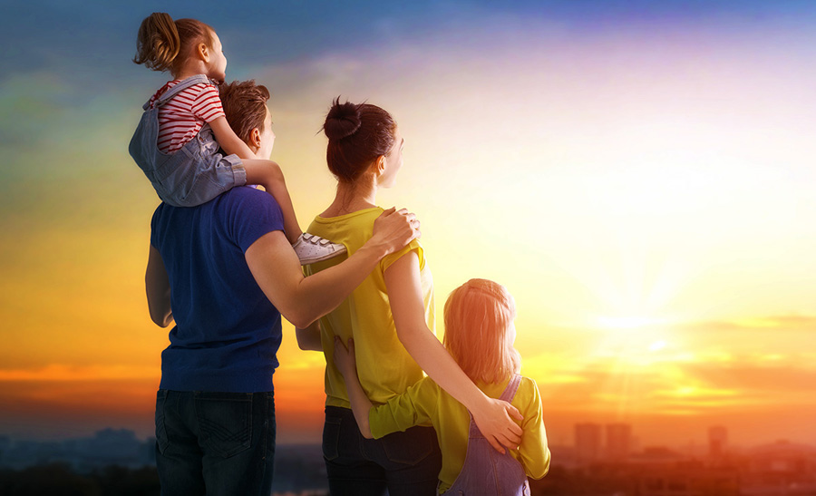 happy family at sunset