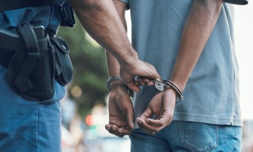 Handcuffs,,Police,And,Hands,Of,Police,Man,With,Criminal,In