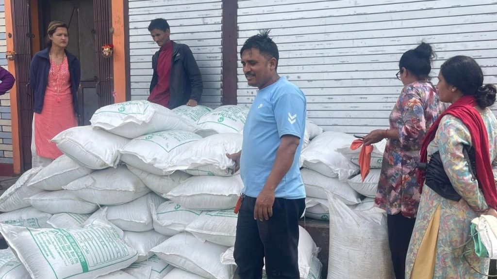 Distribution of improved rice seeds to farmers in Putali Bazaar